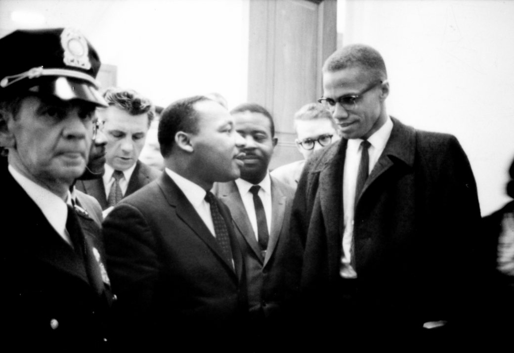 WAITING FOR A PRESS CONFERENCE: Martin Luther King and Malcolm X, 1964.