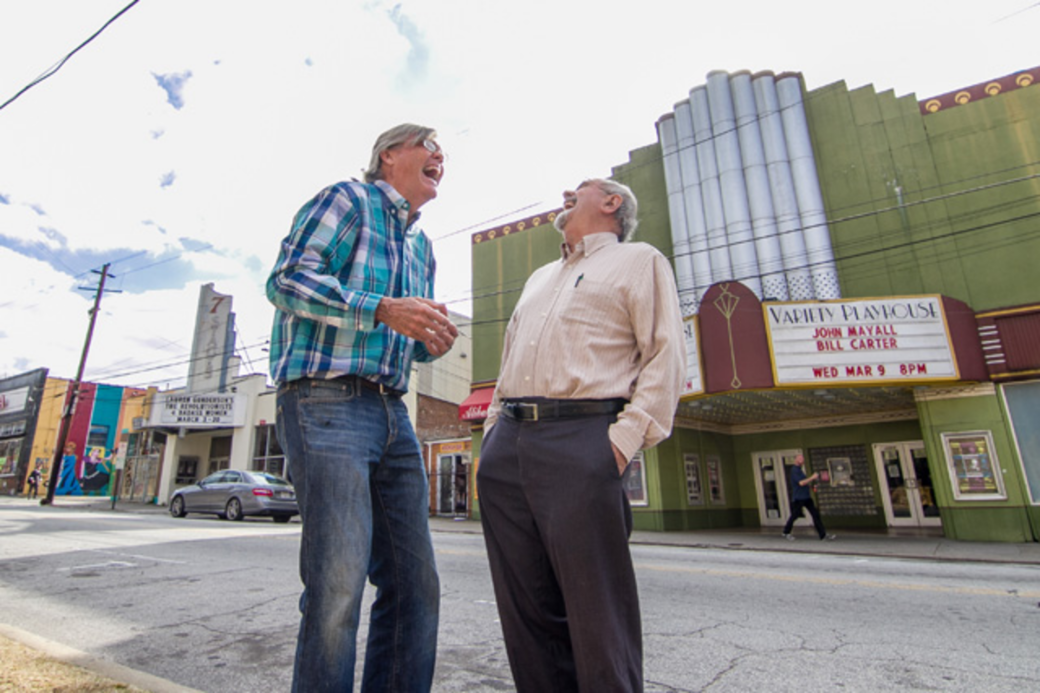 SHOW TIME: Kelly Jordan (left) and Don Bender, pictured in front of two theaters they helped save, led a group of neighborhood residents starting in the 1970s to preserve and revitalize the area.