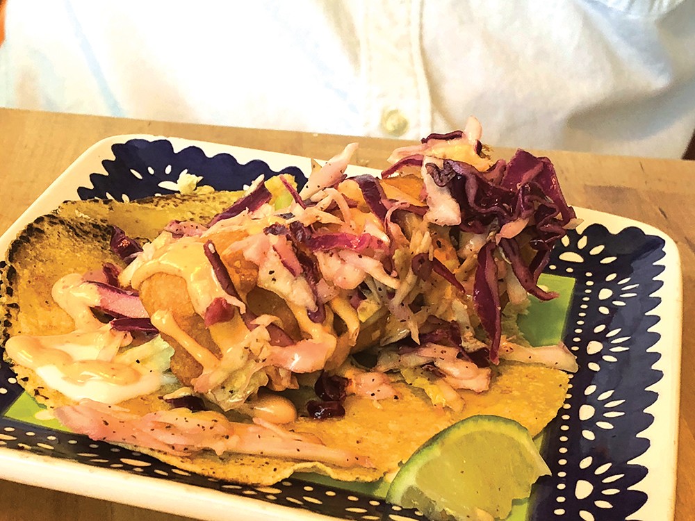 TUZA: The table's best taco — a huge hunk of fried fish draped in pickled cabbage. Photo: Cliff Bostock.