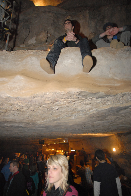 People sat on rocks on multilevels inside the Volcano Room to enjoy the show.