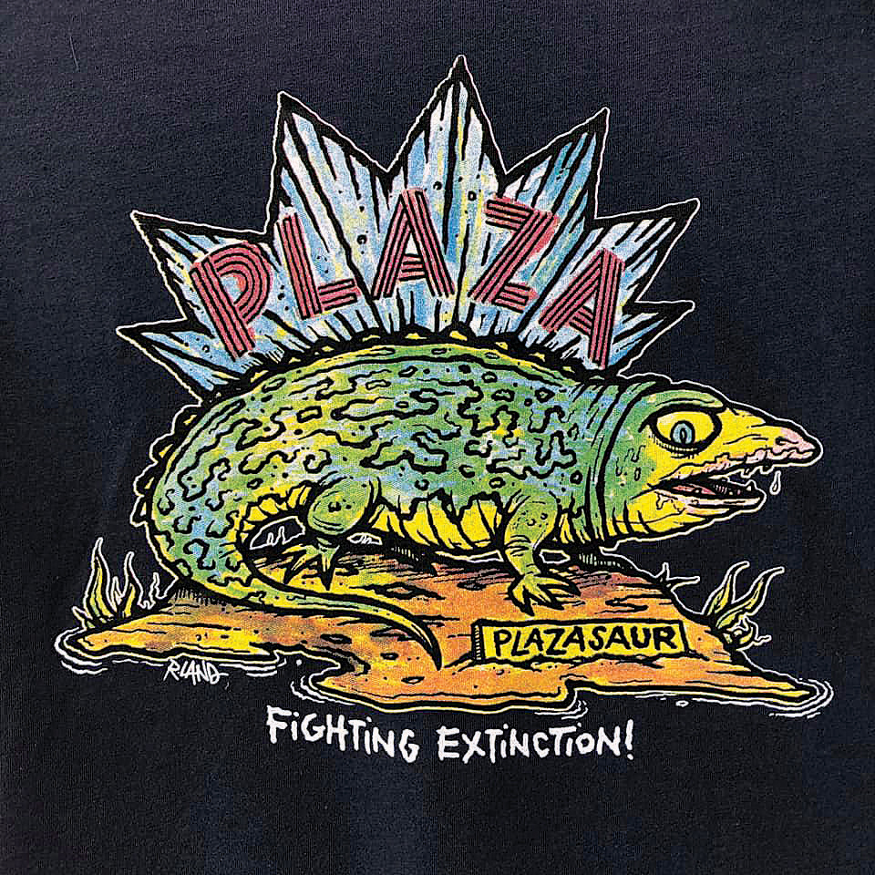 SILVER SCREEN SALUTATIONS: Plaza Theatre owner Chris Escobar has resurrected the theater’s “Plazasaur” t-shirt. Photo credit: R. Land