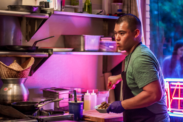 MASTER OF HIS DOMAIN: Chef Parnass Savang works Sunday night dinner service at his Georgian Thai pop-up, Talat Market. Photo by Eric Cash