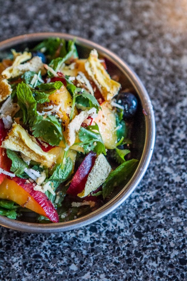 THAILAND MEETS GEORGIA: Yum phonlamai with peaches, bluberries, shallots and lemongrass. Photo by Eric Cash