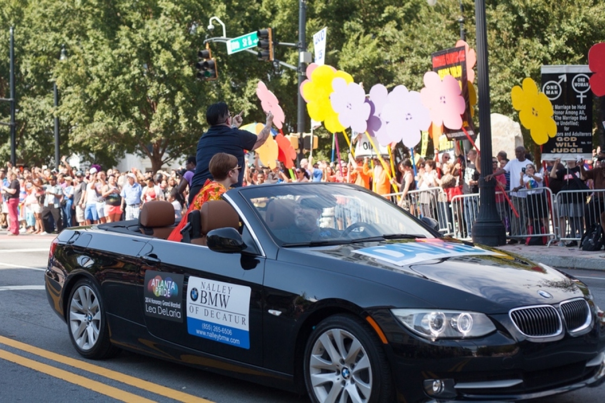 Atlanta Pride 2014's Honorary Parade Marshal Lea DeLaria flips off anti-gay protestors.