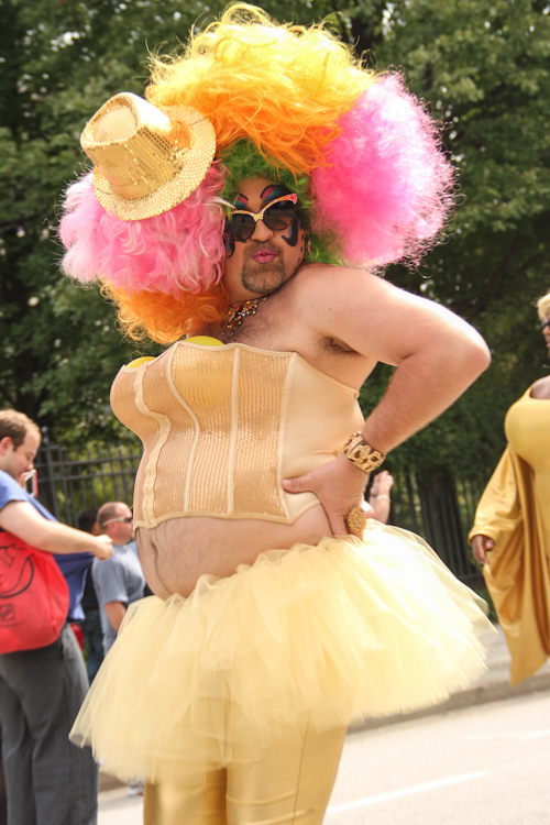 One of the Armorettes, "the Infamous Camp Drag Queens of the South," marches down Peachtree Street.