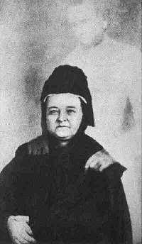 Mary Todd Lincoln with her dead husband, Abe's, ghostly hands on her shoulders. Photo by William H Mumler (1869).