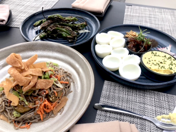 THE TRIO OF STARTERS: A cold noodle salad, garnish-them-yourself deviled eggs, and shishito peppers. PHOTO CREDIT: CLIFF BOSTOCK