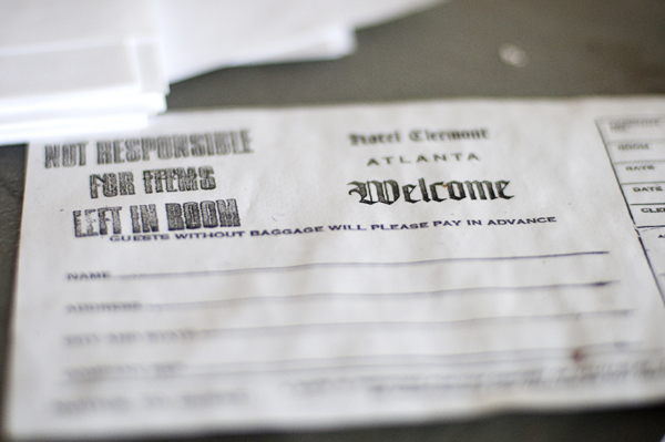On the check-in counter, a slip for visitors still sits on the desk. "Guests without baggage will please pay in advance," the form reads. Photo by Joeff Davis