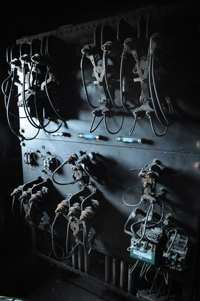 In a small rooftop maintenance room, elevator wires lay idle just above the original shaft. Photo by Joeff Davis.