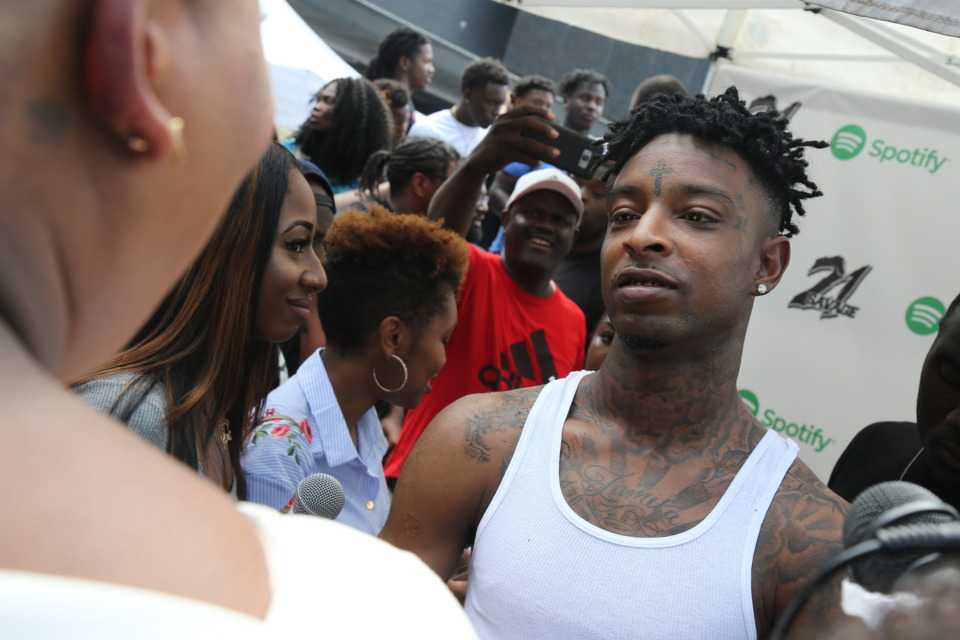 ISSA BACK 2 SCHOOL DRIVE: 21 Savage talks with a fan outside of Club Libra on Aug. 6. Photo Credit: Brandon English