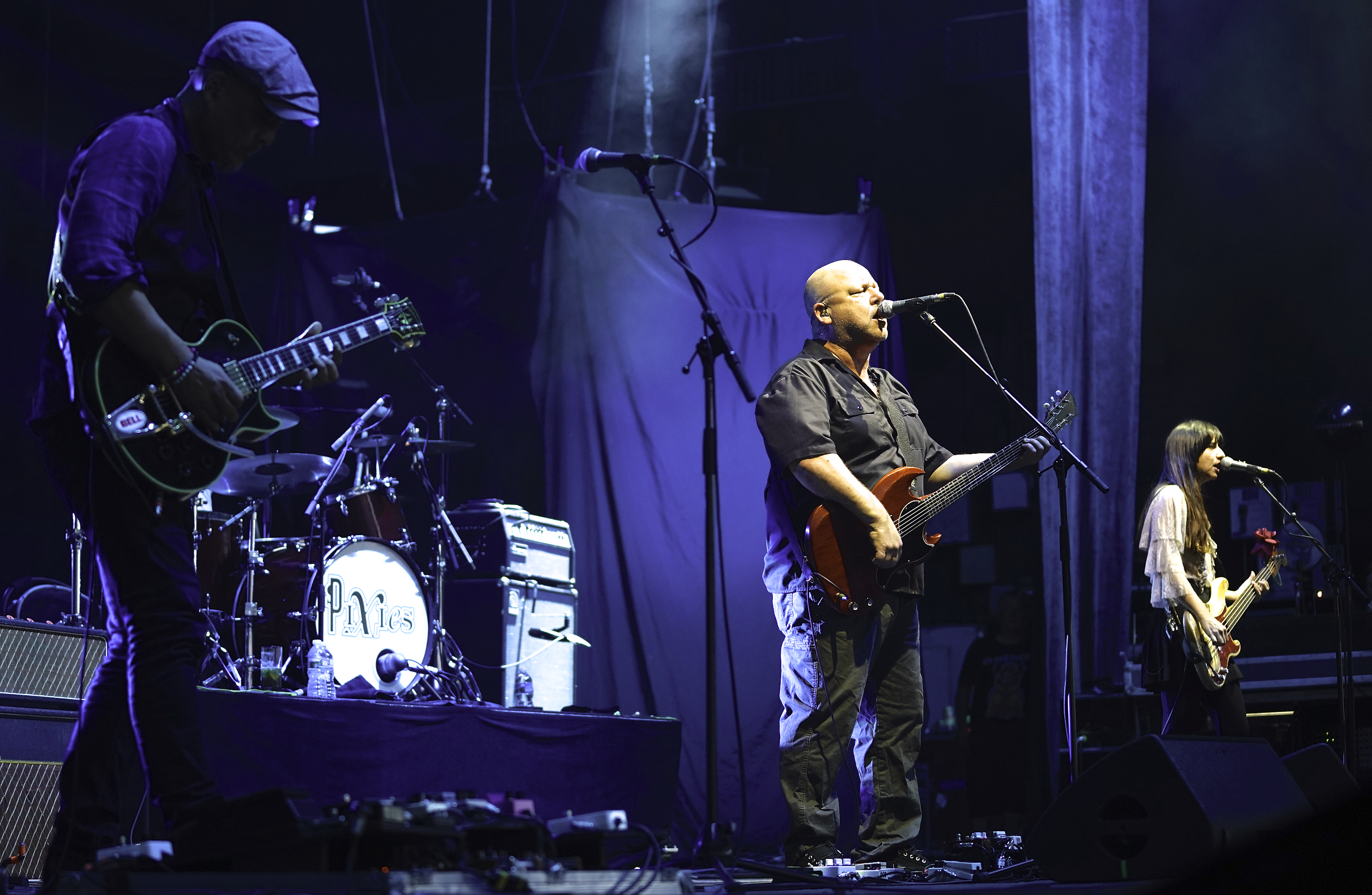 Joey Santiago (from left), Black Francis, and Paz Lenchantin of the Pixies, July 27 at Cellairis Amphitheatre at Lakewood. Photo by Perry Julien.